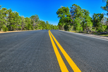 Fototapeta na wymiar Endless American asphalt roads in Arizona state.