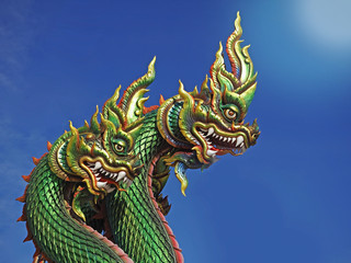 Fototapeta premium King of Nagas or Serpent statue with blue sky Thailand