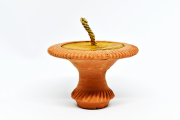 The single terracotta lamp was arranged on a white background.