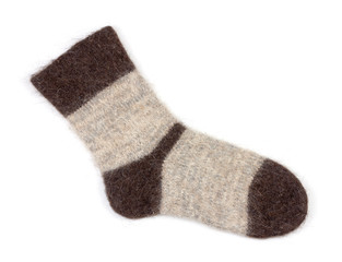 single male grey knitted sock of dog fur on white background close up, top view