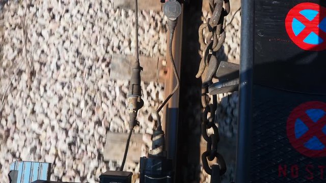 Metal hooks and electric cables that join the train carriages