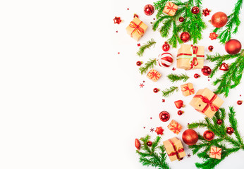 Christmas or New Year background: fir tree branches, red glass balls, decoration and cones on a white background 