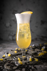 Alcoholic or non-alcoholic cocktail with lemon citrus and ginger with added liqueur, vodka,...