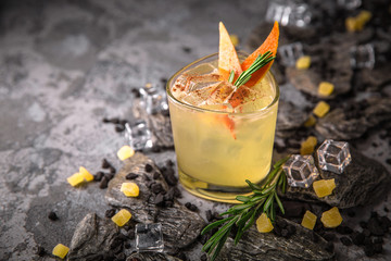 Alcoholic or non-alcoholic cocktail with lemon citrus and ginger with added liqueur, vodka,...