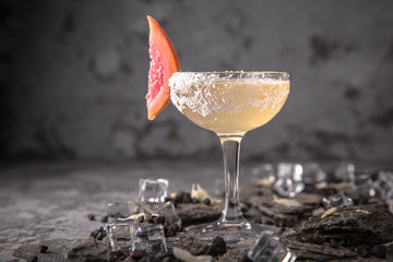 Alcoholic or non-alcoholic cocktail with lemon citrus and ginger with added liqueur, vodka,...
