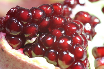 Pomegranate Slice Fruit. Close up Granate Seeds in slice. Macro photo. vitamine and Healthy concept.