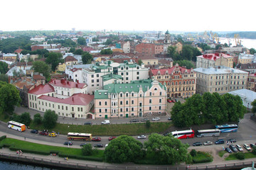 Panorama of the city with beautiful houses with multi-colored roofs from the tower of Olaf, the city of Vyborg, Russia. Top view