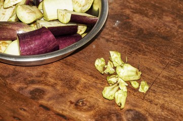 Fresh eggplants on dark wooden background. Vegetarian food, health or cooking concept. Selected focus. Close up.
