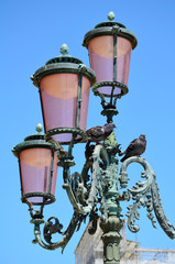 Fototapeta na wymiar Traditional Venetian Pink Lanterns on a Blue Sky, 