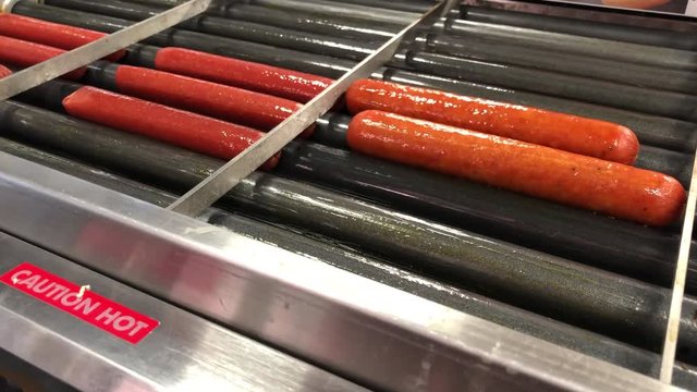 Hotdogs rotating on convient store heat oven