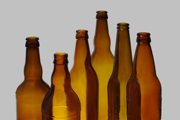 Empty beer bottles. Isolated on a colored background.