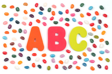 Jelly bean sweets and ABC letters. Education and alphabet concept