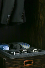 tray of ties and belts