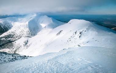 Naklejka premium Snow range of Mala Fatra in Western Carpathians mountains landscape image. Velky Krivan - the top mountain point of view.