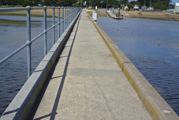 Pier with metal gate on left side and no gate on right side