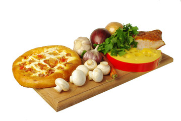 Pizza and its ingredients. Cheese, mushrooms, onions, garlic, parsley, greens. Isolated on white