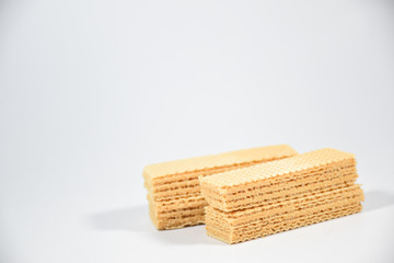 Wafer candy filled with vanilla cream on a white background