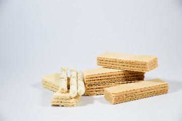 Wafer stick Stuffed with vanilla cream and milk on a white background