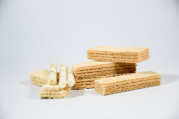 Wafer stick Stuffed with vanilla cream and milk on a white background