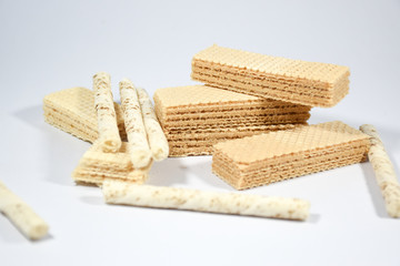 Wafer stick Stuffed with vanilla cream and milk on a white background