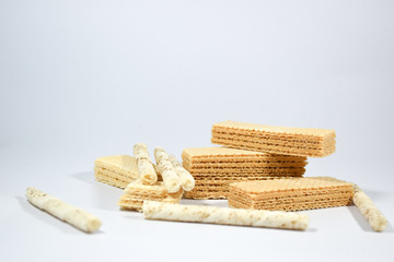 Wafer stick Stuffed with vanilla cream and milk on a white background