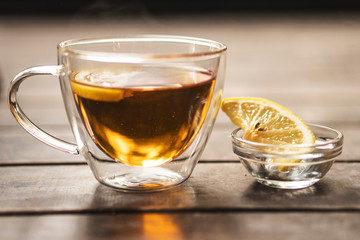 Cup of tea with lemon on table close-up