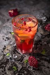 Alcoholic or non-alcoholic cocktail with lemon, lime and cucumber with the addition of liquor, vodka, champagne or martini. Cool drink.