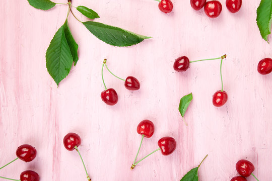 Ripe cherry berries and cherry leaf colourful bright pattern
