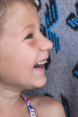 Dairy tooth fell out of the child. Little girl wobble loose tooth