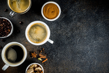 Obraz na płótnie Canvas Coffee cups with beans and ground coffee