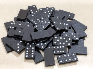 Pile of Black Wooden Domino Pieces Gathered.