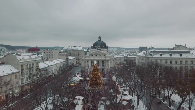 Lviv, Ukraine - 25, December 2018. Arial shot. Opera house. Christmas tree. Christmas Fair. People are walking around the city center