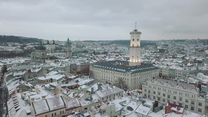 LVOV, UKRAINE - 25, December 2018. Panorama of the ancient city. Ukraine Lviv City Council, Town Hall. The roofs of old buildings. Aerial, drone view. Winter