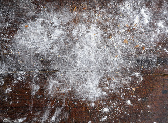 the old brown board is sprinkled with white wheat flour