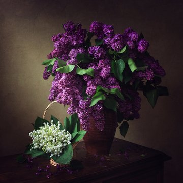 Still life with bouquets  of lily of the valley and lilac