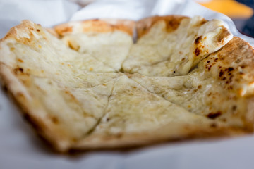 Manakeesh, a savoury flatbread that is popular across the Levant and the Middle East, topped with cheese