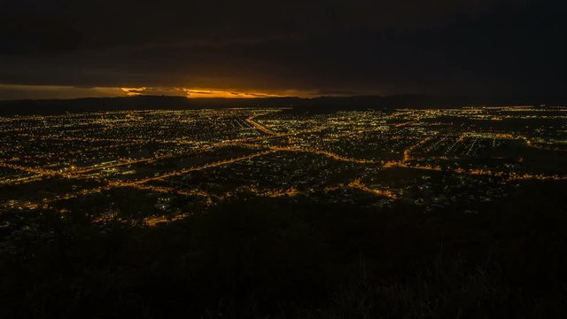Timelapse of Townsville city at night with storm in the background, Australia