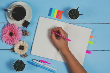 Creatie female Wrieter workspace. Message on paper to a loved one. Magazines social media. Wooden...