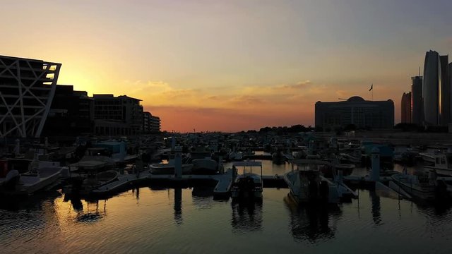 Beautiful view of Abu Dhabi city Etihad towers, famous landscape and Marina boats