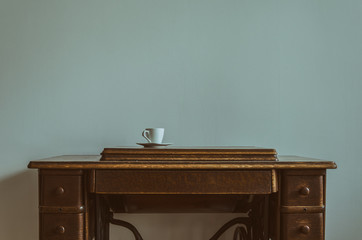 SEWING MACHINE - A cup on an old home appliance