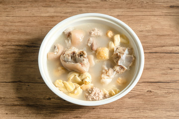 trotter soup with wooden background