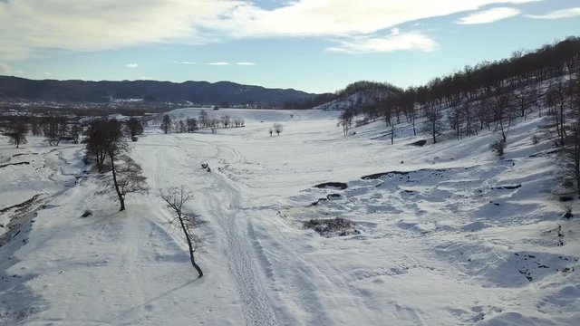 Aerial footage of a winter landscape at the countryside at the Christmas time.