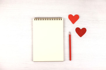 Empty note pad with felt Valentine's hearts.