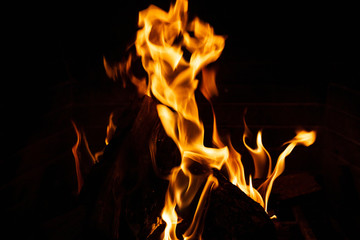 Cozy fireplace. Wood logs burning, relaxation and warm home