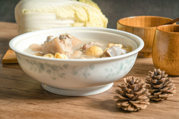 trotter soup with wooden background