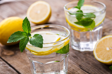 Fresh Lemonade in a Glasses with Lemon Slices and mint