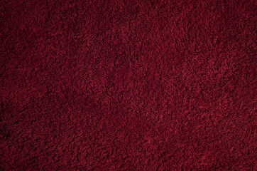 Detailed abstract dark red textural textile background.