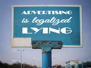 Advertising is legalized lying. An old metal billboard.
