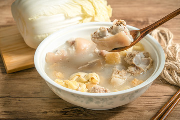 trotter soup with wooden background