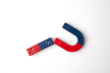 Two magnets on white background